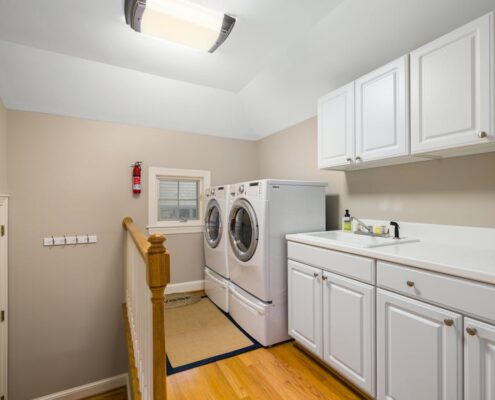 A home laundry room with a modern washer and dryer