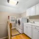 A home laundry room with a modern washer and dryer