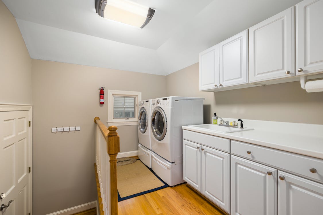 A home laundry room with a modern washer and dryer