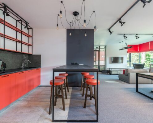 A modern, red and white kitchen