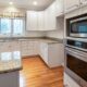 A picture of a modern kitchen with a microwave