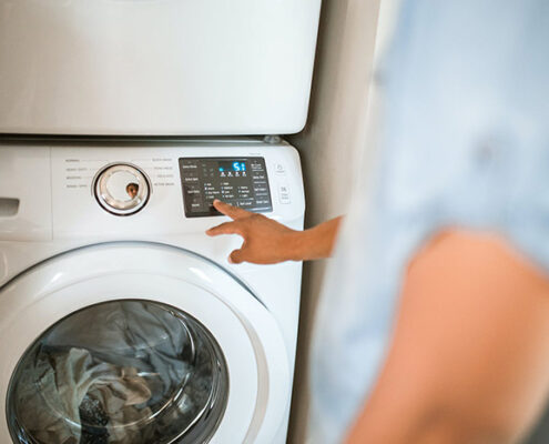 Man using a washing machine